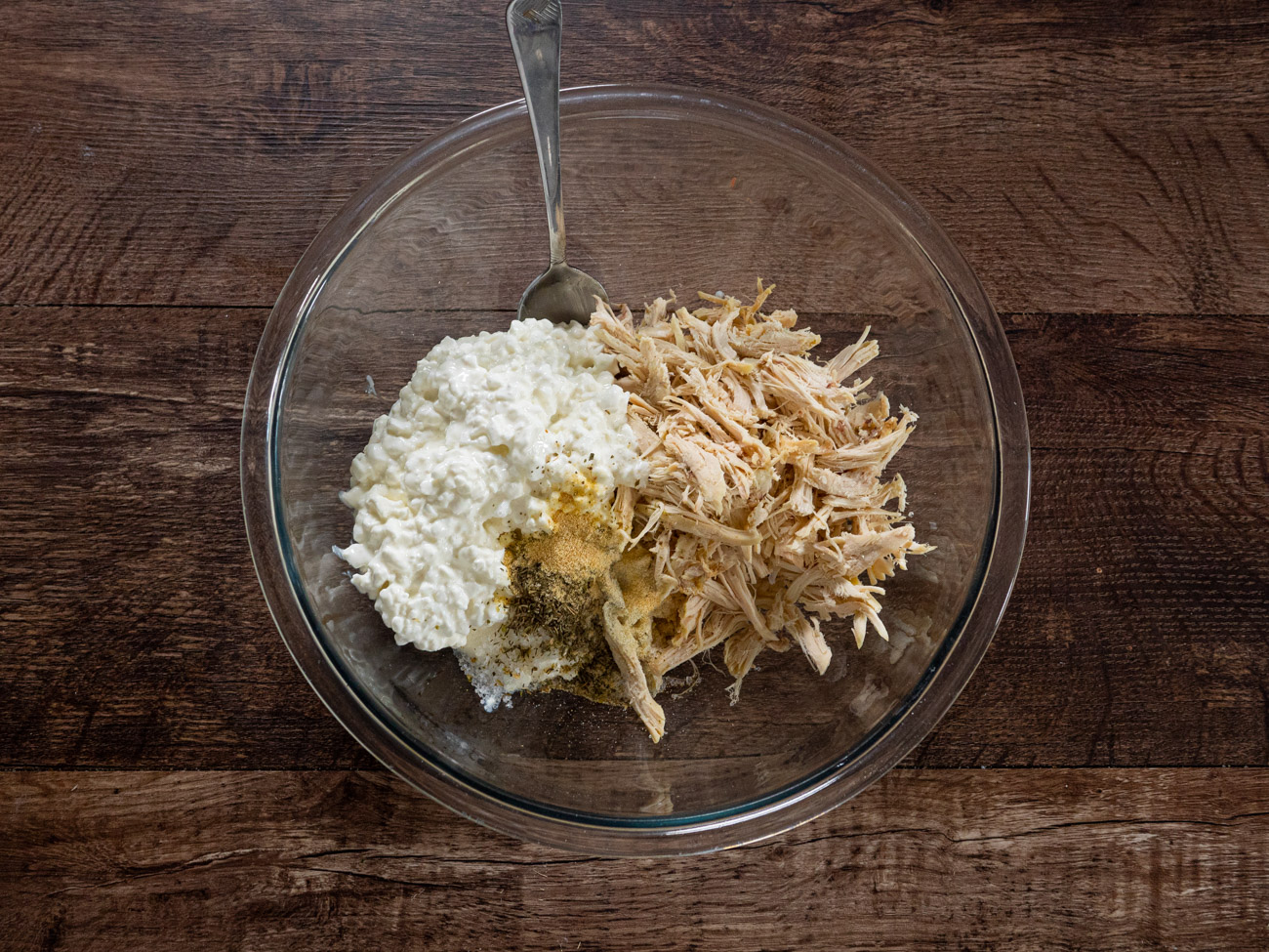 Combine shredded chicken, cottage cheese, salt, onion powder, garlic powder, and Italian seasoning in a large bowl.